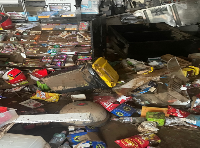 Muddy floodwaters filled Hooper’s Grantham Store, ruining products, and collapsing equipment.