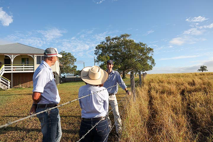 Farm Debt Restructure Officer Manager Dan Elder talking to Farm Business Analysis Assistance clients, Lance and Kym Baker.