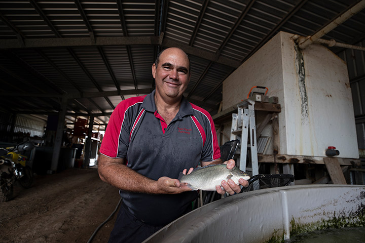 Steven Volz holding a perch