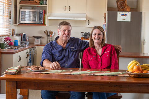 Michael and Brenda Bulley sitting at their dining table